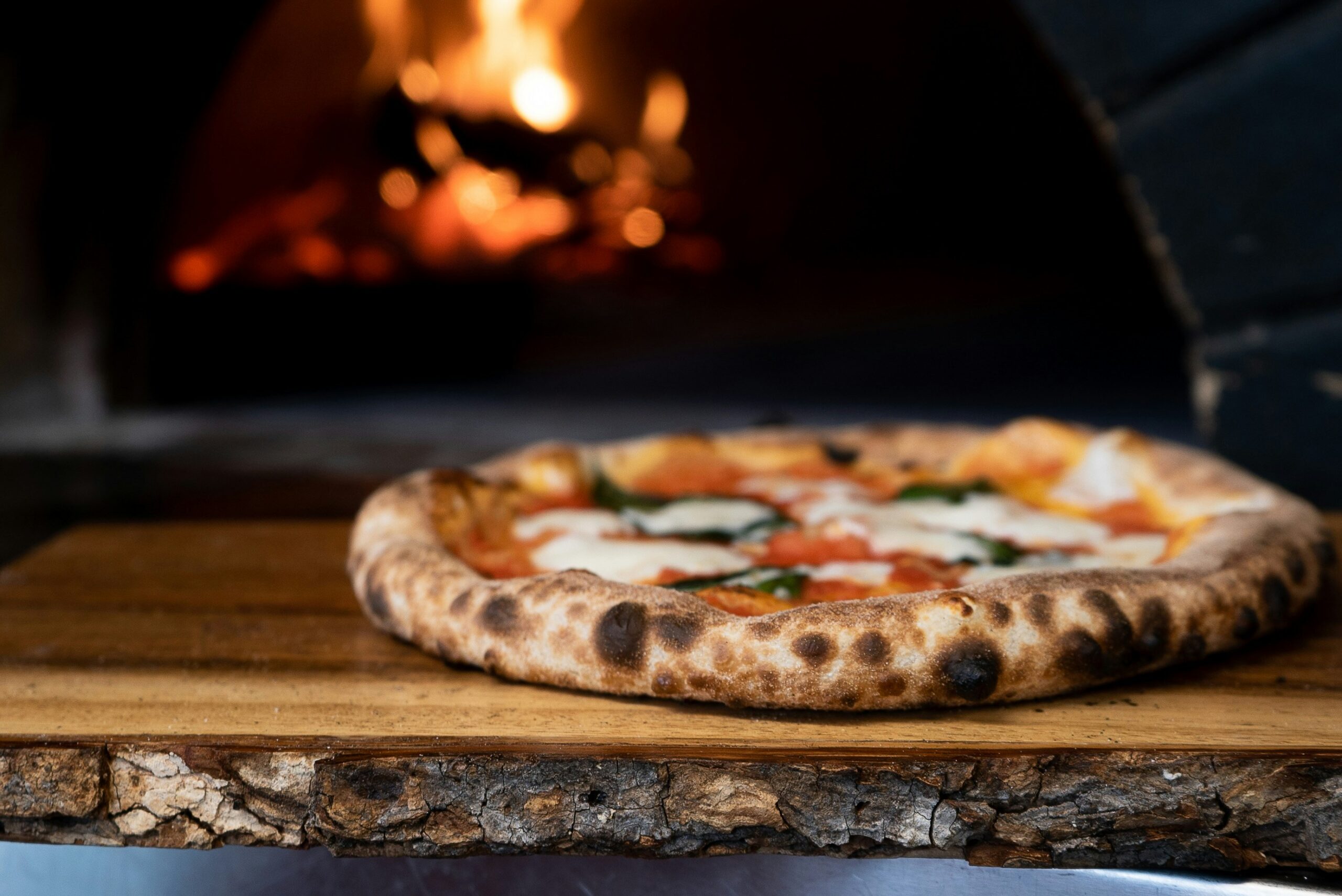 Pizza on a serving board.